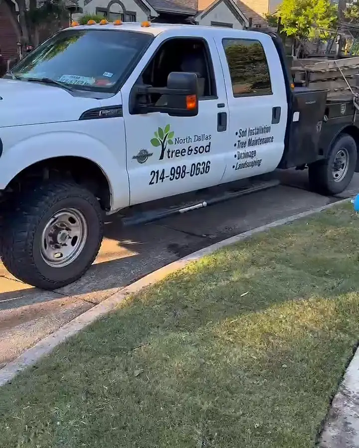 North Dallas Tree & Sod work truck beside a newly sodded lawn